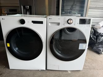 New LG smart front-load washer and dryer with large capacity, stackable.