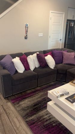 grey section couch picture and rug