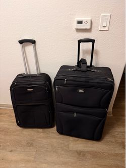 Two suitcases - must go!