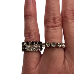 Set of two rhinestone stretch rings, sizes 5 & 7 stretchable. One with black stones and three layers. 