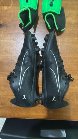 Puma cleats and shin guards