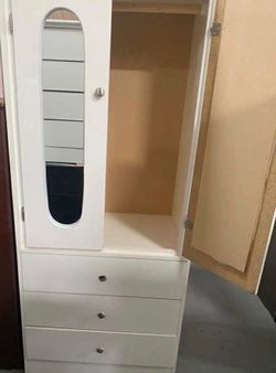Tall white closet with mirrors