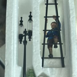 a Department 56 "Lamplighter With Lamp" accessory set, item number 55778. 