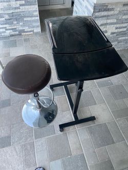 Portable rolling table in black, excellent for laptop. Very good condition. Also rotatory chair.
