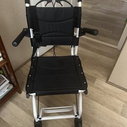 Black and white transport chair