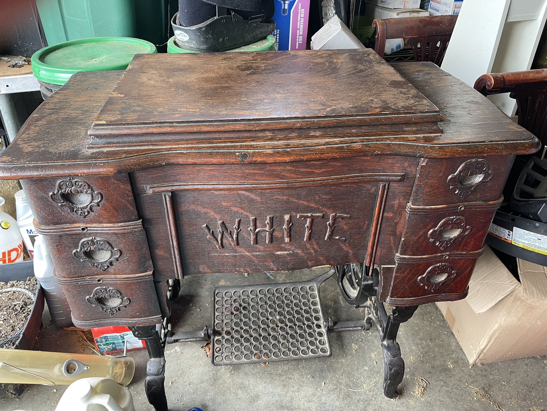 Antique white treadle sewing machine