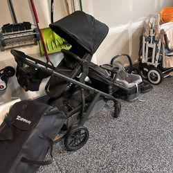 Up a baby stroller with bassinet and two full seats
