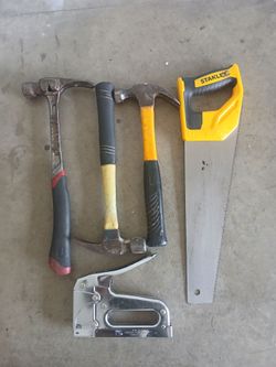 Tools hammer & saw wood
