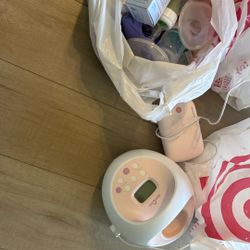 Breast Pump With All Accessories Bearly Used New Bottles 