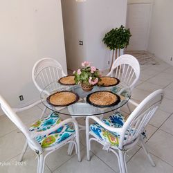 4' round glass table top with matching base and four rattchairs