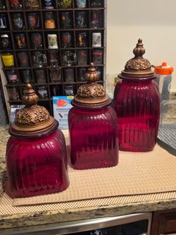 Red Glass Canister Set with Ornate Bronze Lids