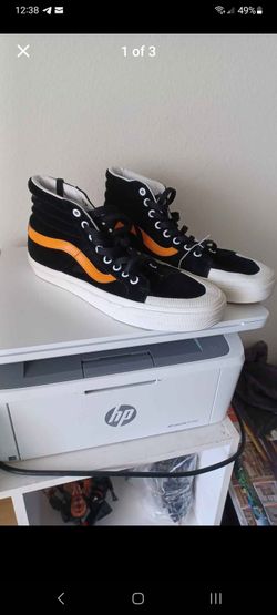Vans Sk8-Hi Reissue 138 sneakers in the Black/Zinnia colorway.