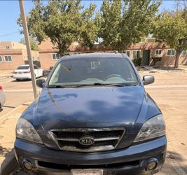 Kia SUV – Dark Blue with Roof Rails