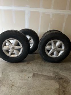Selling a set of 4 Goodyear Wrangler tires with Nissan alloy rims. Used condition. Great for someone looking for a complete set. Please message me if 