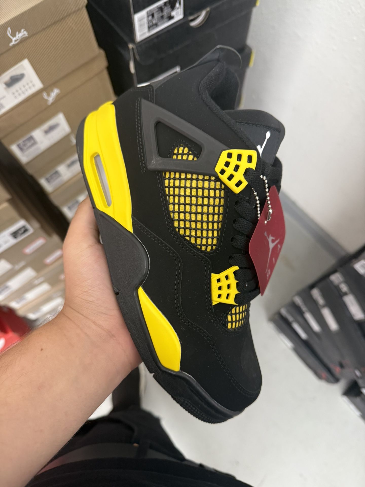 Yellow Thunders Jordan 4s