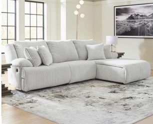 Top tier by Ashley recliner sectional with press back chaise