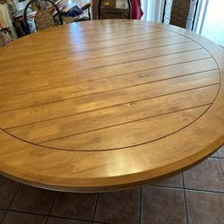 70inch solid round wood table  29 inches tall Oakwood