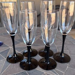 Black stemmed champagne glasses