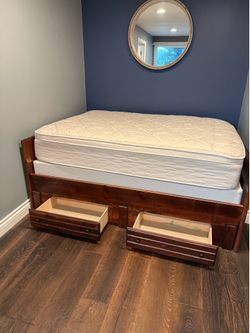Full size bed with storage drawers, matching desk, box spring and mattress also included.  From Ashley furniture