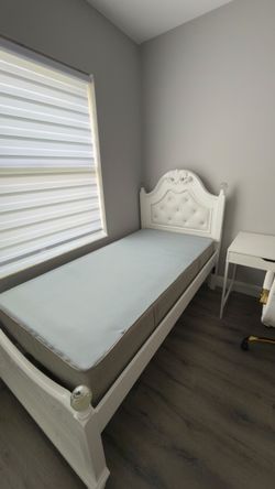 White Twin Bed Frame with Tufted Headboard. Rooms to Go