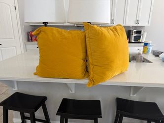 2 yellow pillows.