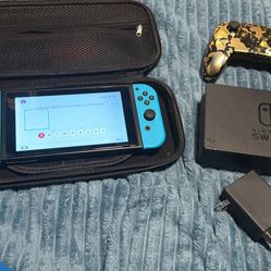 Nintendo switch with docking station, controller, charger, case and 128 gb memory card. No trades. Cash only. No Venmo, cashapp or Zelle 