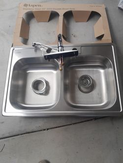 Kitchen sinc with drain and ganbage disposal part, and Faucet everything new pick up only