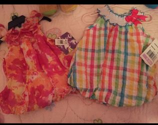 Baby girl 6-9 & 12 mos dresses. Brand new. $15 both.