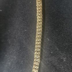 Silver brace of a gold overlay