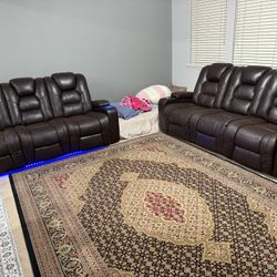 2 reclining leather couches