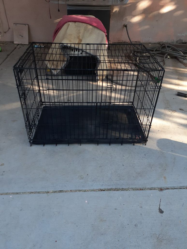 Pets cage, good condition like New, 2 doors, solid steel,size 36l×22w×24 1/2h.