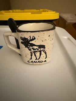Canada cup with tiny stir spoon