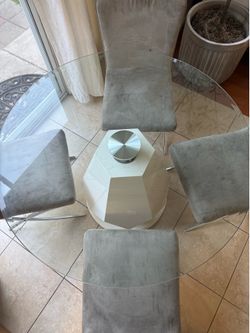 Dining table with glass top and 4 chairs