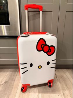 New with tags Sanrio Hello Kitty hard shell carry-on luggage spinner suitcase