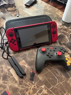 Nintendo Switch with Red Joy-Cons and Bowser Controller