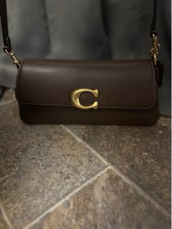 Brown leather coach purse