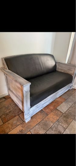 Rustic Wood Frame Loveseat with Dark Cushions