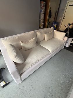 White Fabric Sofa with Throw Pillows