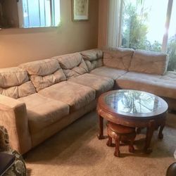 Large Tan Microfiber Couch / Sofa - 2 Sections Has one small hole that was sewn. Lite wear on one leg.  This couch is very easy to maintain and is ver