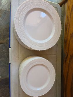 New white Decorativr Plastic Party plates.