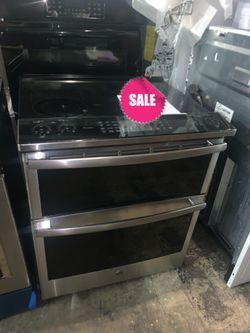 SALE - New GE slide in double oven electric range with 6 months warrnty