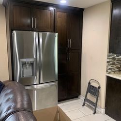 Kitchen Cabinets And Table With Countertop