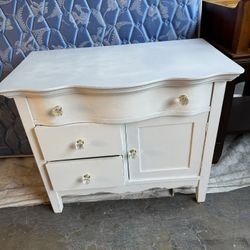 White 3-drawer dresser w/ storage cabinet . Good condition. Measurement: 3-drawer w/ cabinet:  32 1/2L x 19 deep x 27H.