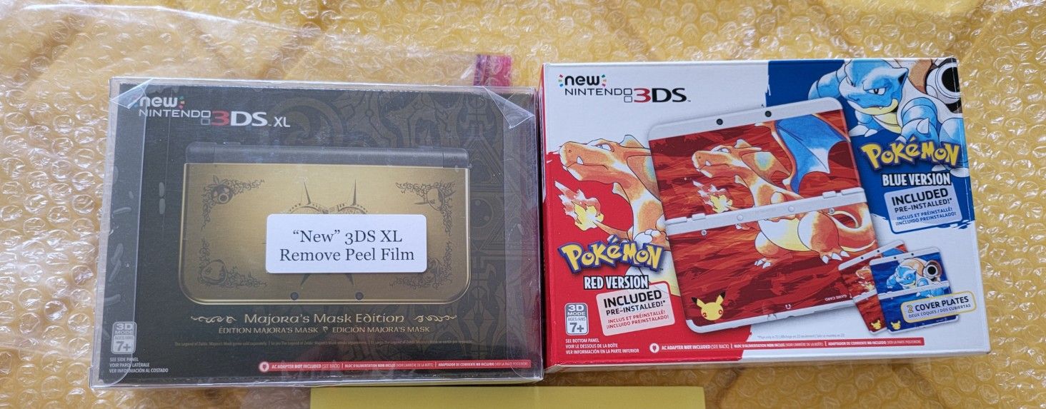 NEW Pokémon 20th RED and BLUE Anniversary Edition  & New Nintendo 3DS XL Legend of Zelda Majora's Mask Edition  BOTH BRAND NEW NEVER USED