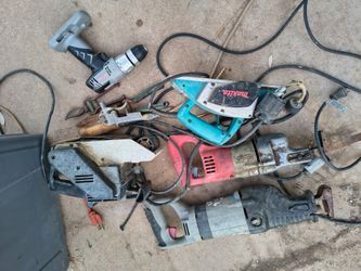 Box of power tools sawzall belt sander planer