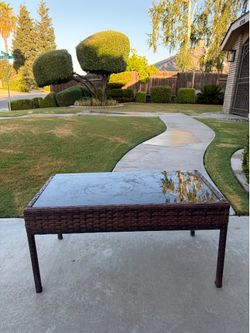 16 inch high x 30 inch long x17 inch wide table with glass top