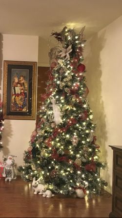9 feet Xmas tree with lights Was adjusted to fit 8 Foot ceiling