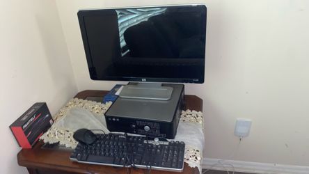 Hp W2338h Monitor And A Dell Pc And A Dell Keyboard And Mouse