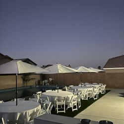 Umbrella sets includes tables, umbrella, plastic folding chairs and linens  R. E. N.     T. A.    L.  Adelanto, Victorville, phelan, apple valley, Lit