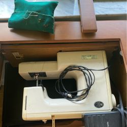 Sewing machine in cabinet